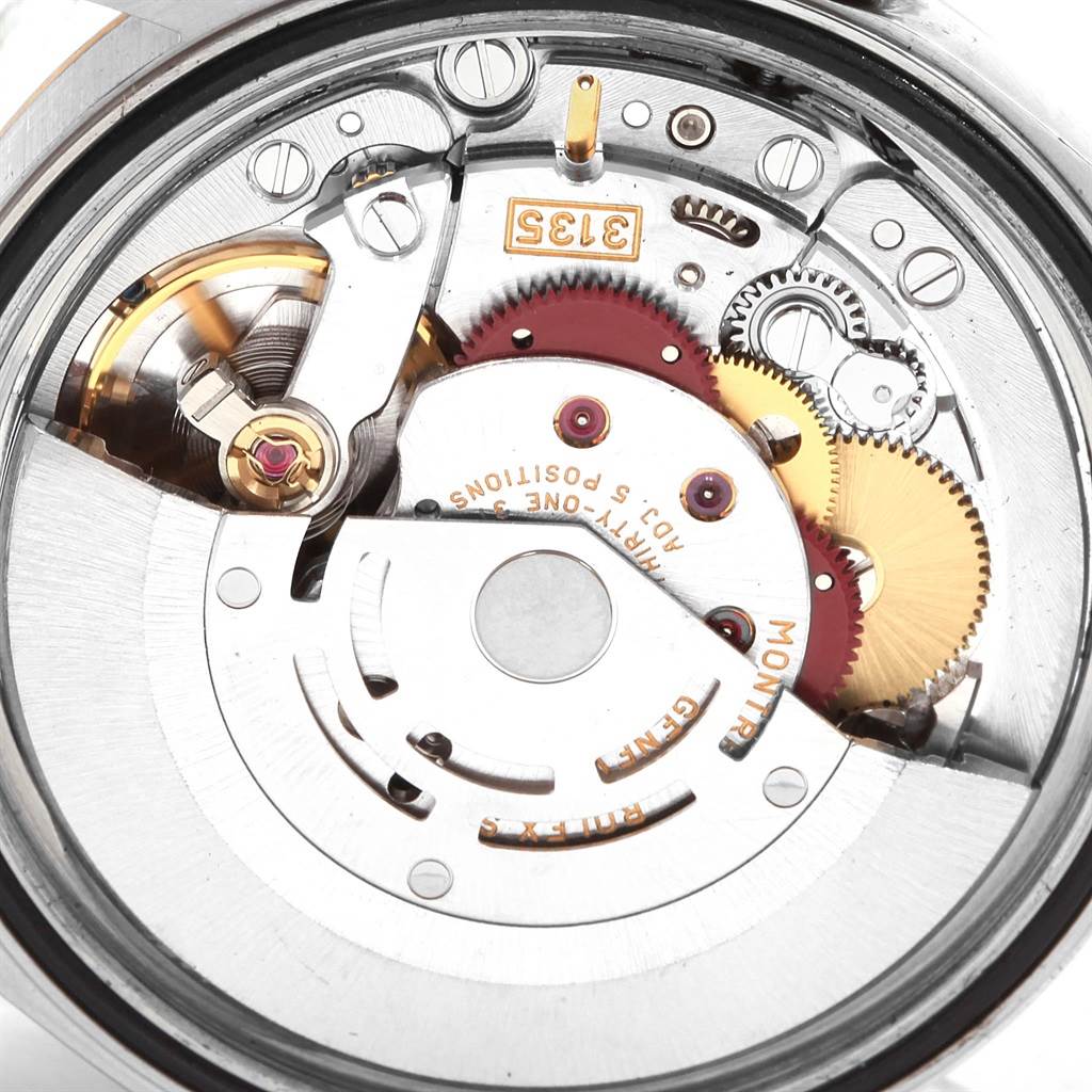 The image shows a close-up of the internal mechanical movement of a Rolex Datejust 20208 Men
s Steel and Gold (two tone) Grey Dial 20208 Men
s Steel and Gold (two tone) Grey Dial watch from a rear angle.