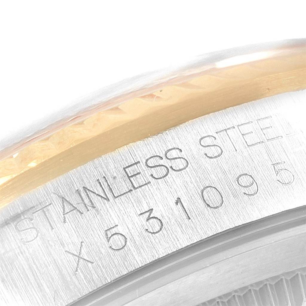 This image shows a close-up of the bezel and serial number engraving on a Rolex Datejust 16233 Men
s Steel and Gold (two tone) White Dial 16233 Men
s Steel and Gold (two tone) White Dial watch.