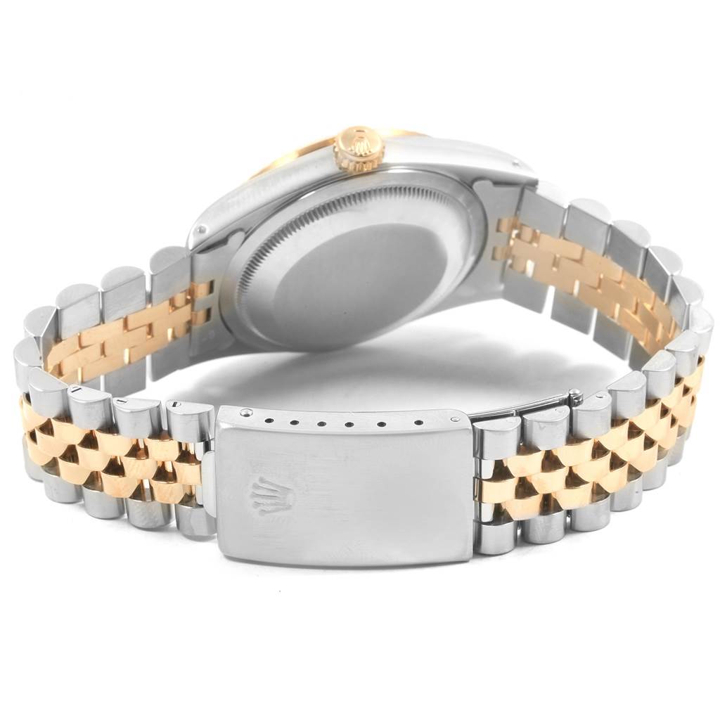 The image shows the back and clasp of a Rolex Datejust 16233 Men
s Steel and Gold (two tone) White Dial 16233 Men
s Steel and Gold (two tone) White Dial watch with a two-tone metal bracelet.