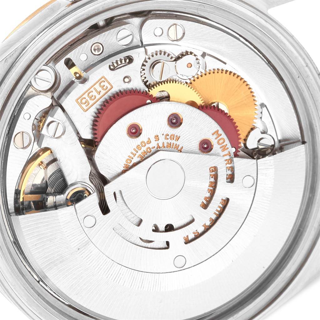 This image shows the mechanical movement and intricate inner workings of a Rolex Datejust 16233 Men
s Steel and Gold (two tone) White Dial 16233 Men
s Steel and Gold (two tone) White Dial watch.