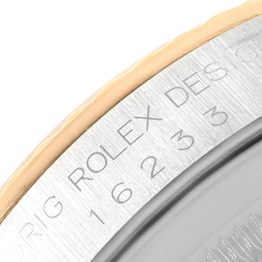 The image shows a close-up of the bezel and part of the dial of a Rolex Datejust 16233 Men
s Steel and Gold (two tone) Champagne Dial 16233 Men
s Steel and Gold (two tone) Champagne Dial watch.