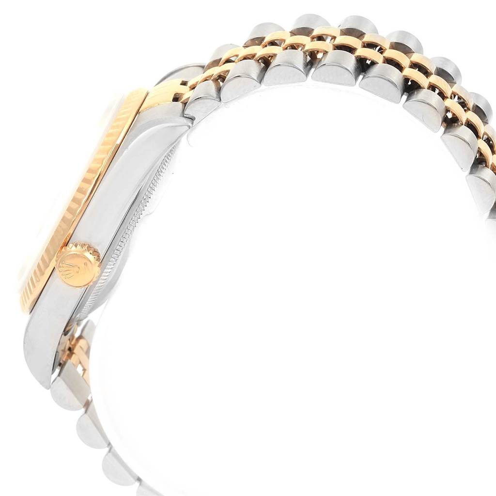 The image shows a side view of the Rolex Datejust 16233 Men
s Steel and Gold (two tone) Champagne Dial 16233 Men
s Steel and Gold (two tone) Champagne Dial watch, highlighting the crown, bezel, and part of the two-tone Jubilee bracelet.