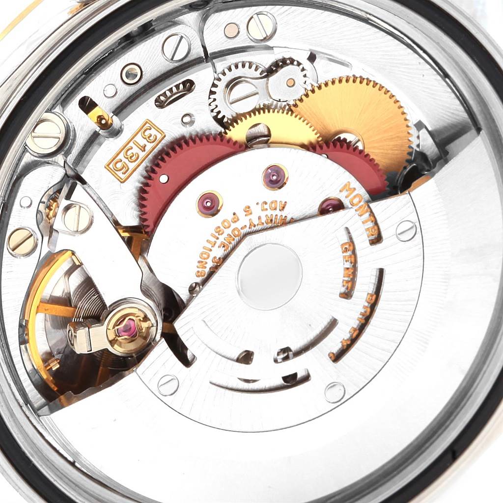 The image shows the internal movement mechanism of a Rolex Datejust 16233 Men
s Steel and Gold (two tone) Champagne Dial 16233 Men
s Steel and Gold (two tone) Champagne Dial watch at a close-up angle.