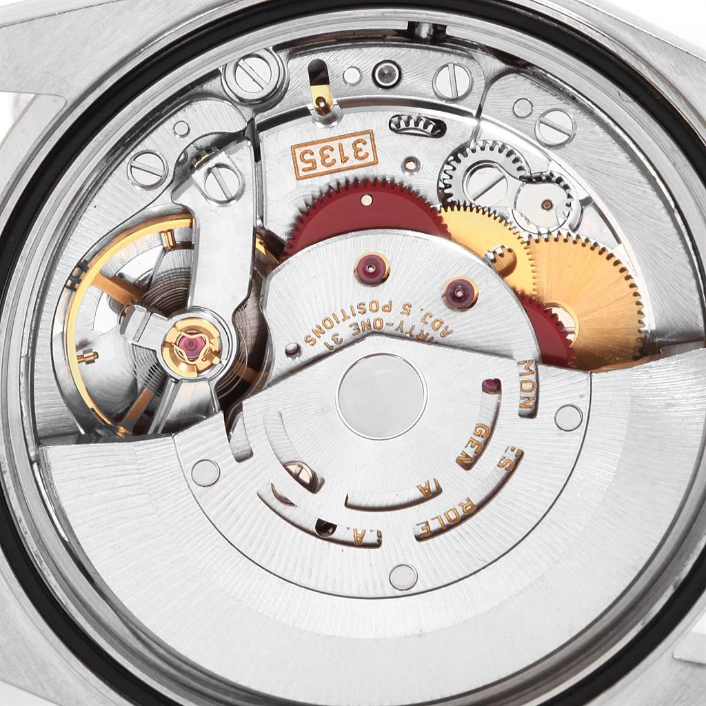 This image shows the intricate inner mechanism of the Rolex Datejust 16233 Men
s Steel and Gold (two tone) Beige Dial 16233 Men
s Steel and Gold (two tone) Beige Dial model from a rear angle, highlighting its movement parts.