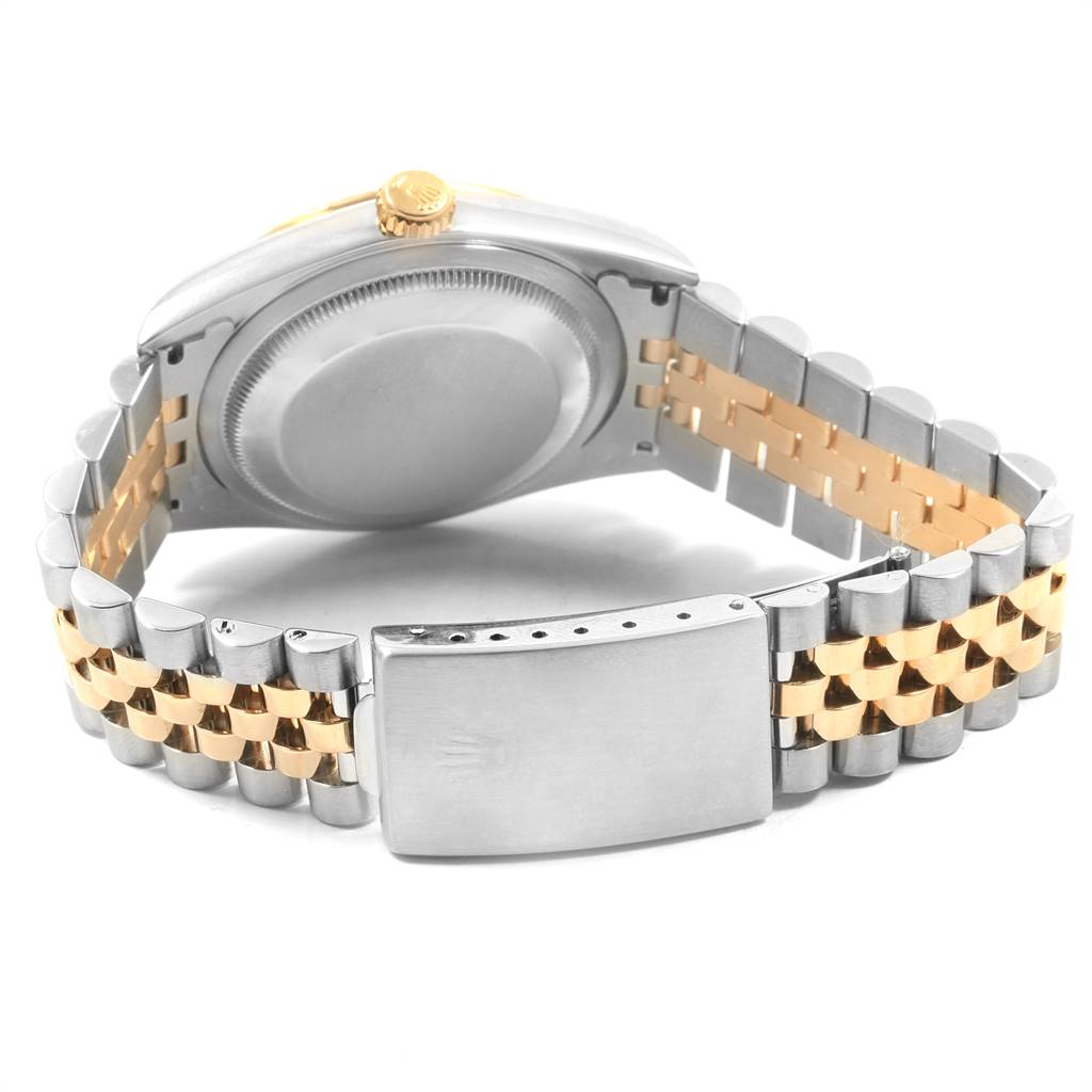 This image shows the back case and Jubilee bracelet with a clasp of the Rolex Datejust 16233 Men
s Steel and Gold (two tone) Beige Dial 16233 Men
s Steel and Gold (two tone) Beige Dial watch at an angle.