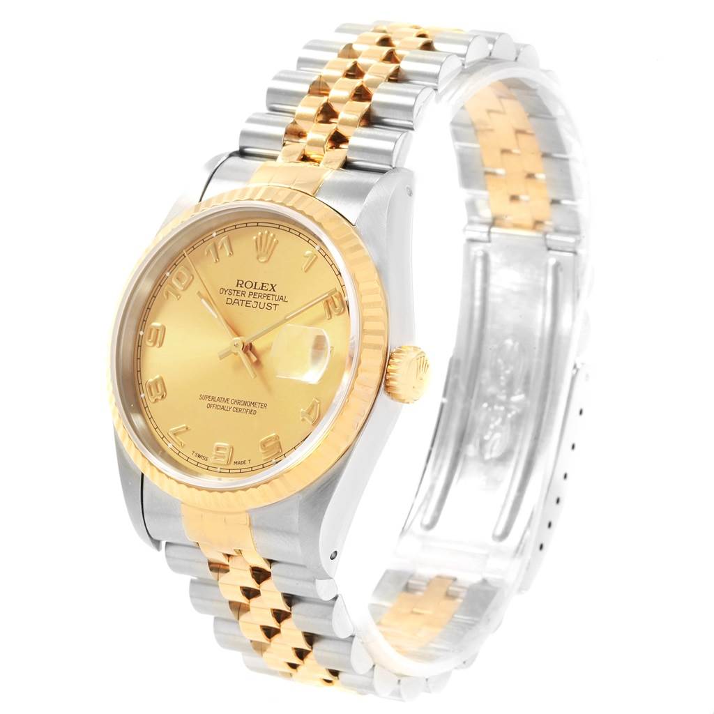 This image shows a Rolex Datejust 16233 Men
s Steel and Gold (two tone) Champagne Dial 16233 Men
s Steel and Gold (two tone) Champagne Dial watch at a side angle, highlighting its two-tone bracelet, fluted bezel, and dial.