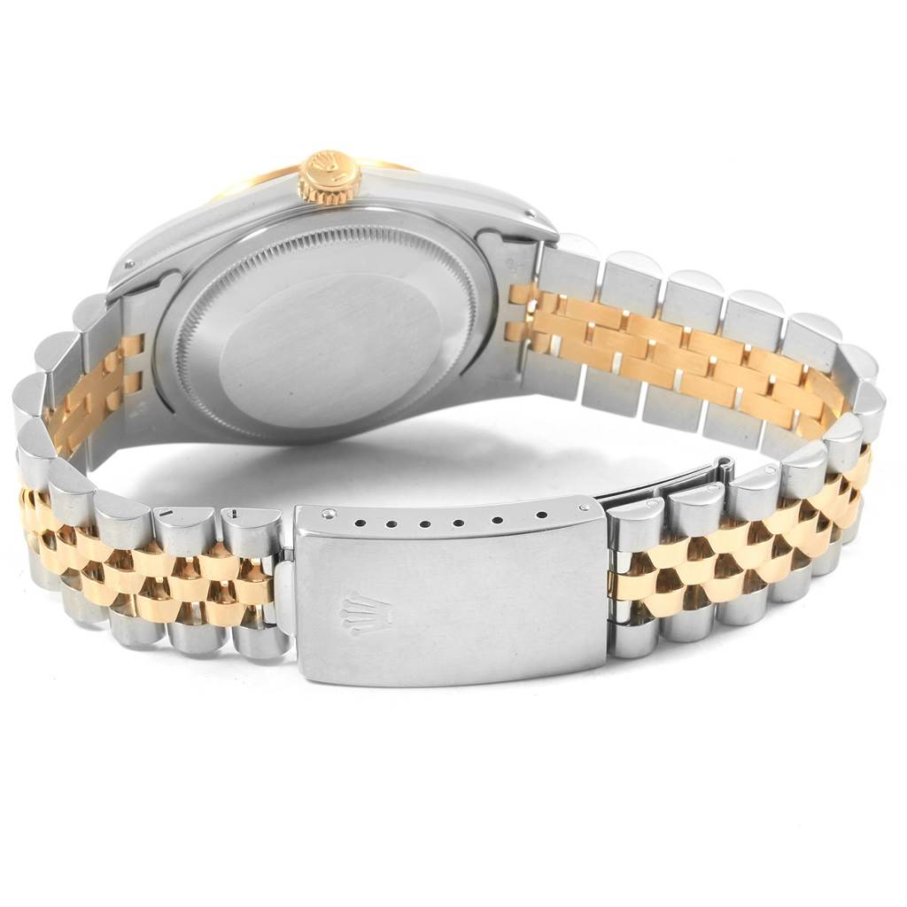 This image shows the back view of a Rolex Datejust 16233 Men
s Steel and Gold (two tone) Champagne Dial 16233 Men
s Steel and Gold (two tone) Champagne Dial watch, including the case back, crown, and two-tone bracelet with a clasp.