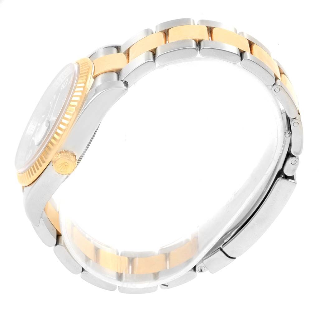 This image shows a side view of the Rolex Datejust 116233 Men
s Stainless Steel Blue Dial 116233 Men
s Stainless Steel Blue Dial watch, highlighting its two-tone bracelet and crown.