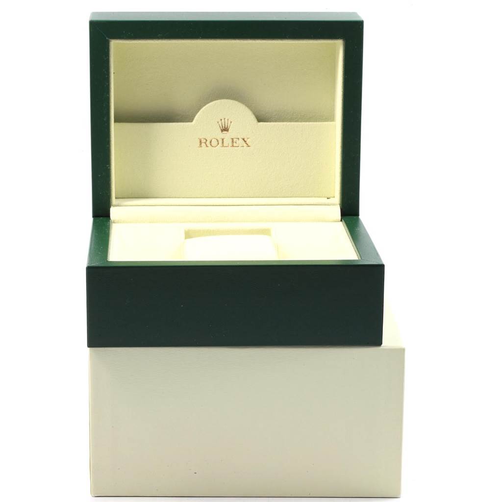 This image shows an open green and cream Rolex watch box for the Datejust model.