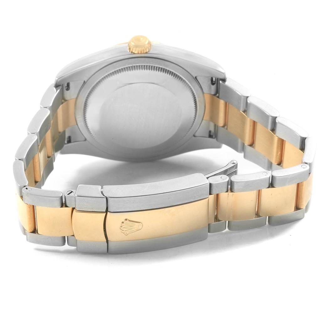 The image shows the back of a Rolex Datejust 116233 Men
s Stainless Steel Blue Dial 116233 Men
s Stainless Steel Blue Dial watch, highlighting its case back, crown, and two-tone bracelet with a clasp.