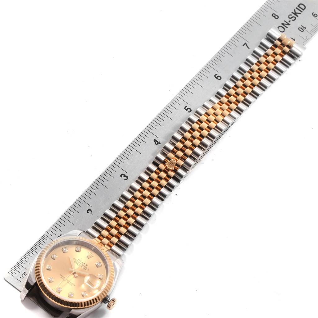 The image shows a Rolex Datejust 116233 Men's Stainless Steel Champagne Dial 116233 Men's Stainless Steel Champagne Dial model watch laid flat with a ruler for measurement, showing the face and bracelet.