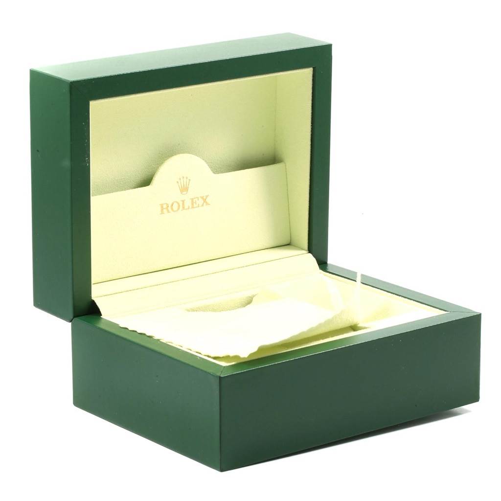 The image shows an open green Rolex box, likely for the Datejust model, with the interior and the Rolex logo visible.