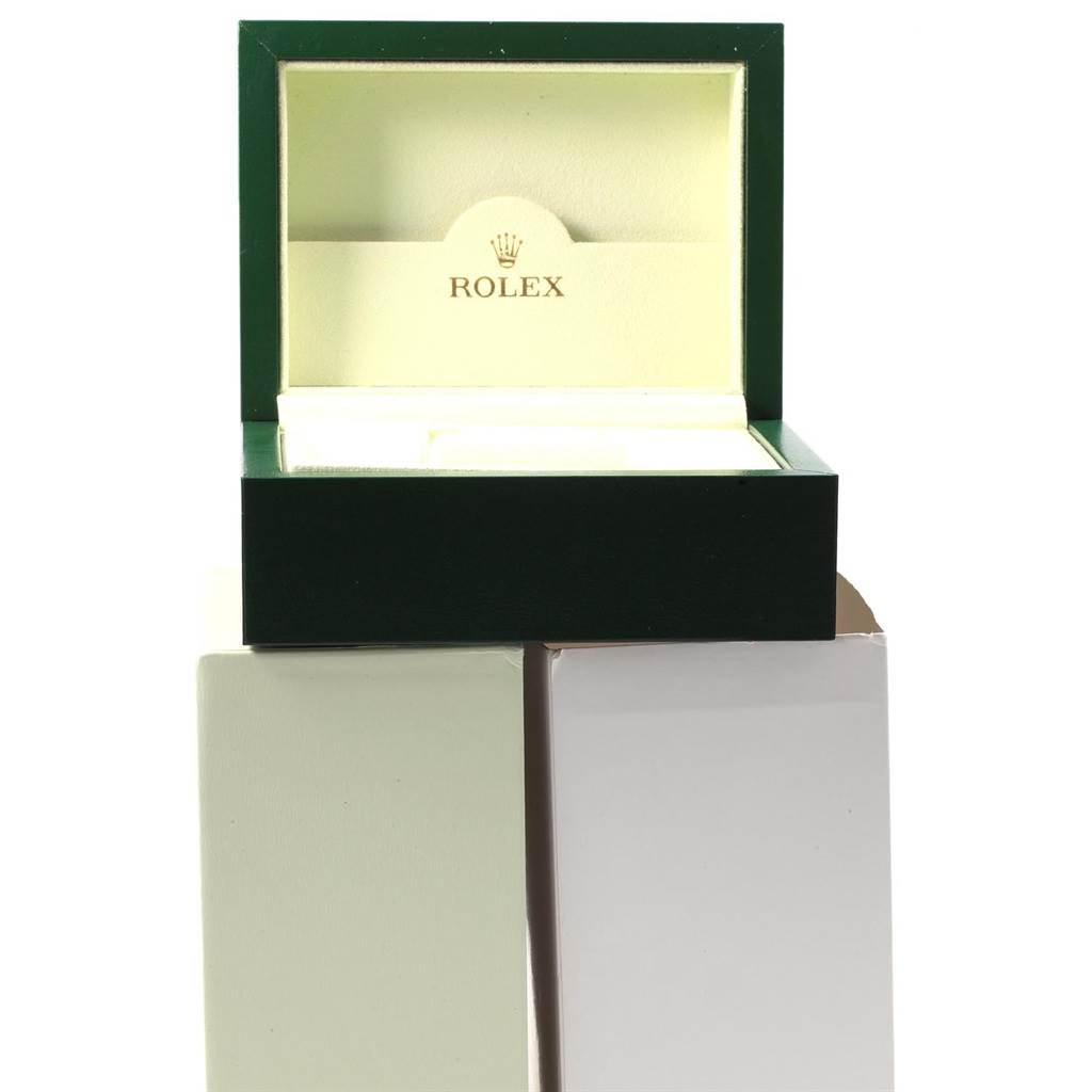 The image shows an open Rolex watch box for the Datejust model, viewed from the front.