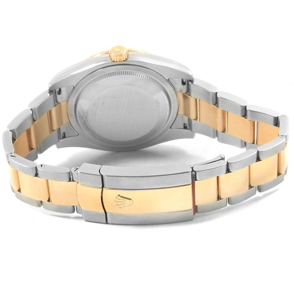 The image shows the back case and bracelet clasp of a Rolex Datejust 116243 Men's Stainless Steel Champagne Dial 116243 Men's Stainless Steel Champagne Dial watch, highlighting its two-tone silver and gold band.