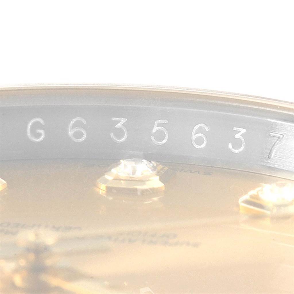 The image shows a close-up of the serial number "G 635637" on the Rolex Datejust 116243 Men's Stainless Steel Champagne Dial 116243 Men's Stainless Steel Champagne Dial model watch case edge.