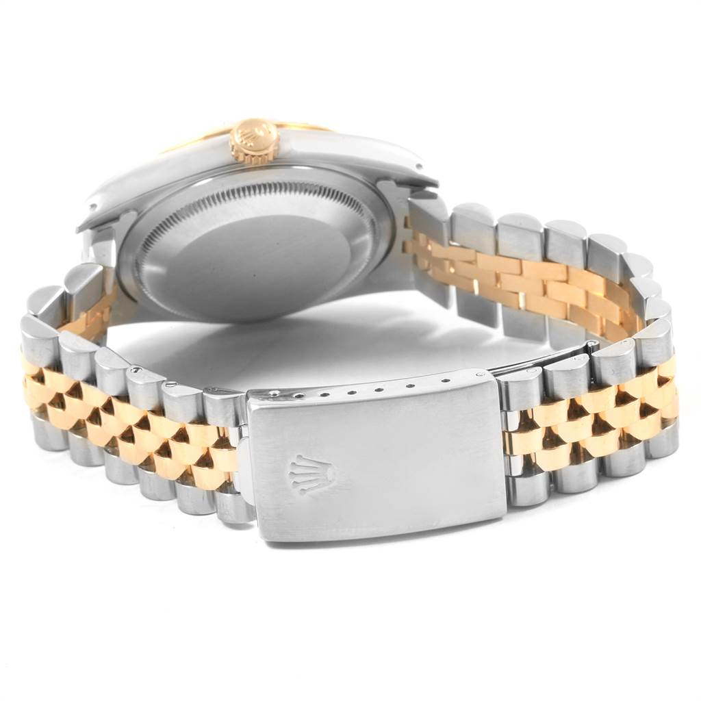 The image shows the back and side view of a Rolex Datejust 16233 Men
s Steel and Gold (two tone) Beige Dial 16233 Men
s Steel and Gold (two tone) Beige Dial watch, highlighting the case back, crown, and bracelet with its clasp.