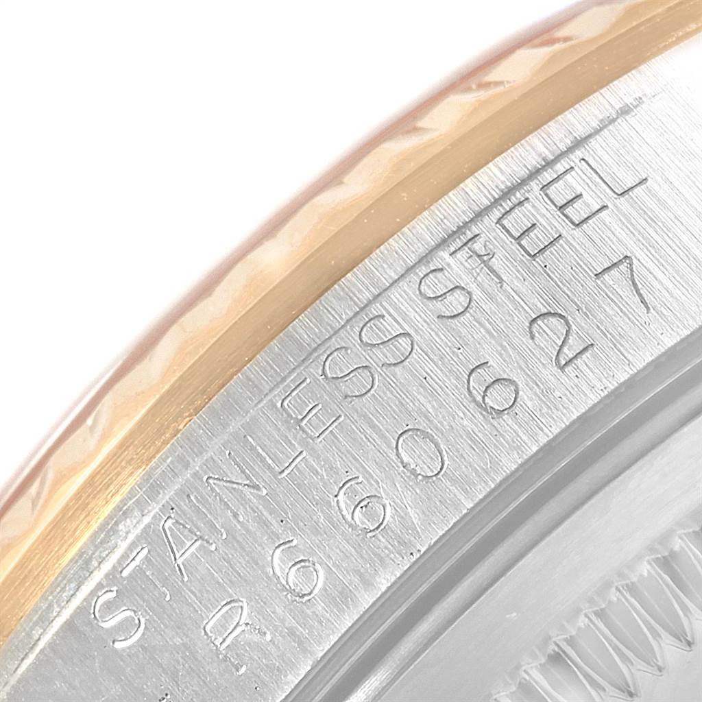 This image shows a close-up of the stainless steel case side of a Rolex Datejust 16233 Men
s Steel and Gold (two tone) Beige Dial 16233 Men
s Steel and Gold (two tone) Beige Dial.