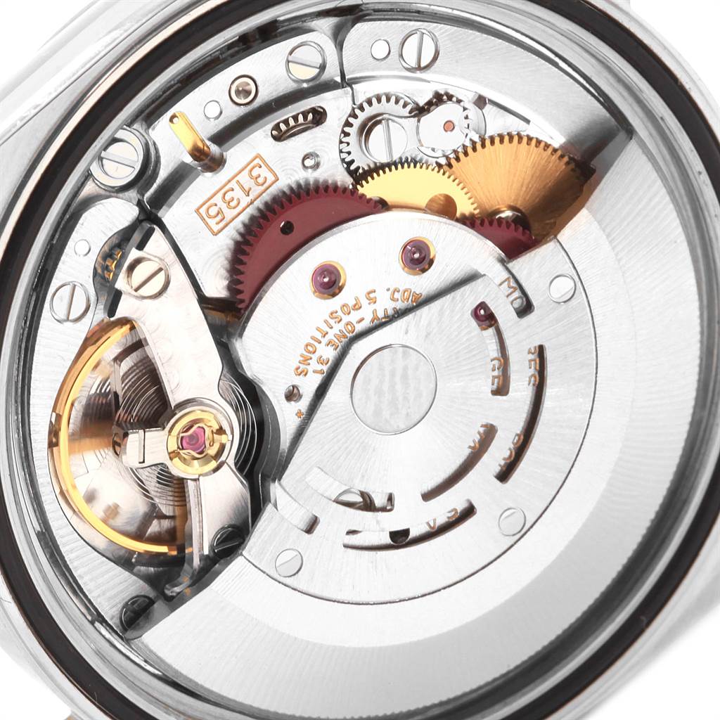 This image shows a close-up view of the movement mechanism inside a Rolex Datejust 16233 Men
s Steel and Gold (two tone) Beige Dial 16233 Men
s Steel and Gold (two tone) Beige Dial watch, revealing gears and intricate components.