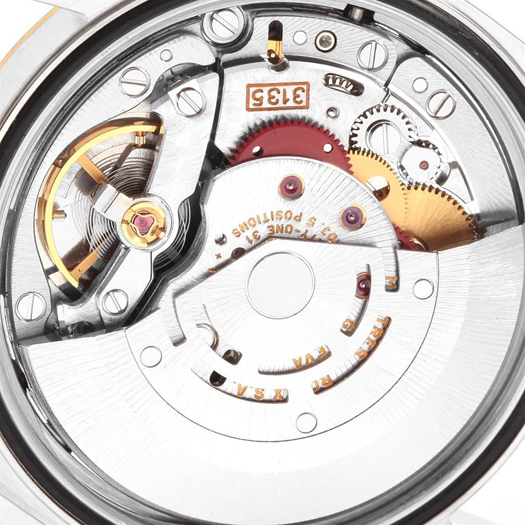 This is an angled close-up showing the movement mechanism of a Rolex Datejust 16233 Men's Steel and Gold (two tone) White Dial 16233 Men's Steel and Gold (two tone) White Dial watch.