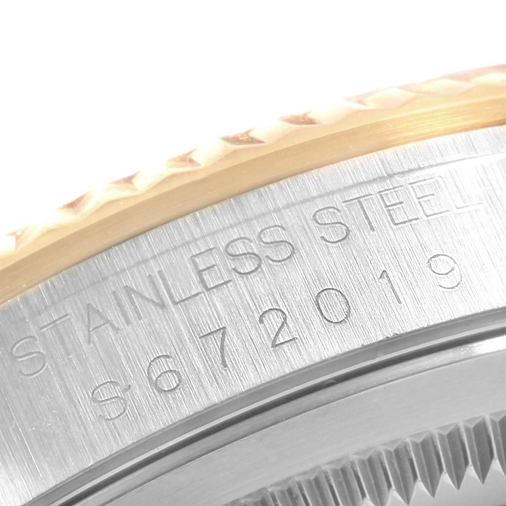 This close-up shot shows the serial number engraving and part of the bezel on the Rolex Datejust 16233 Men's Steel and Gold (two tone) White Dial 16233 Men's Steel and Gold (two tone) White Dial watch.