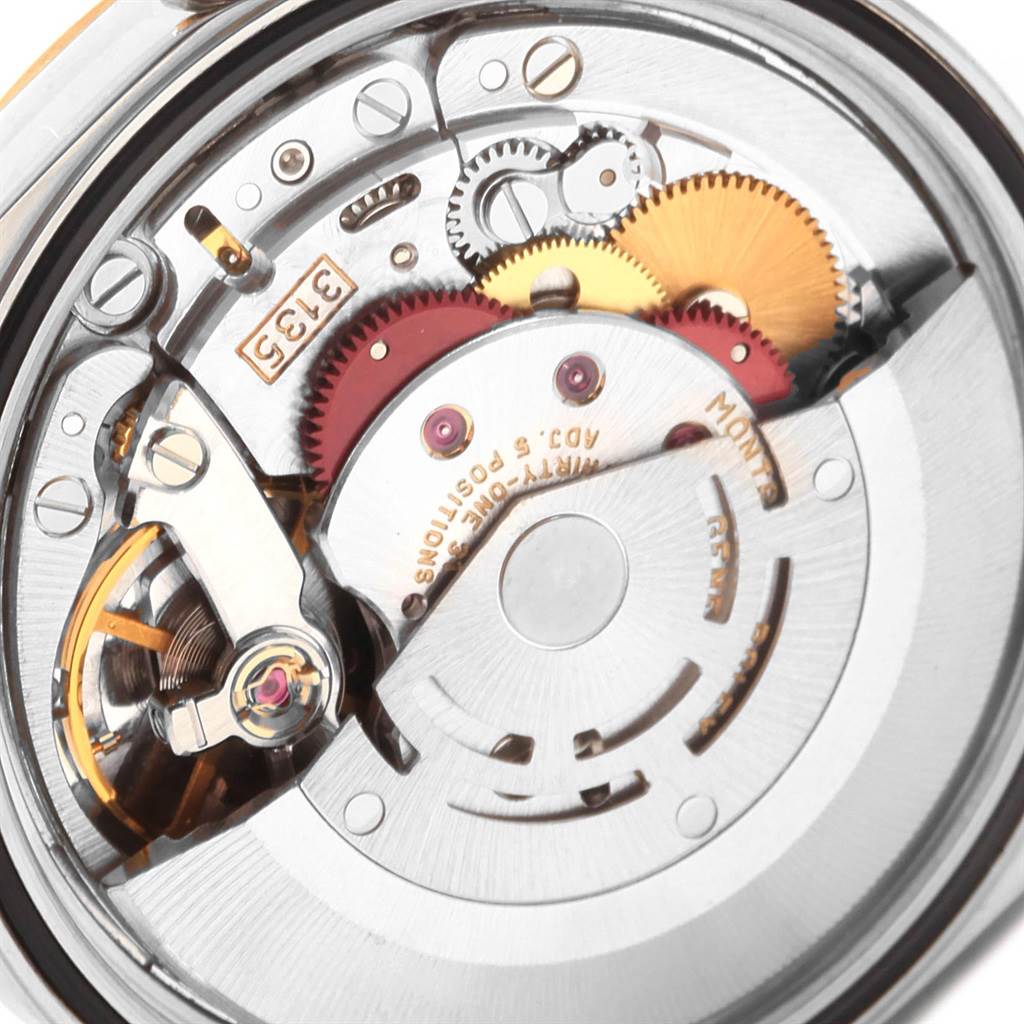 This is a close-up view of the movement and internal components of a Rolex Datejust 16233 Men's Steel and Gold (two tone) Champagne Dial 16233 Men's Steel and Gold (two tone) Champagne Dial watch.