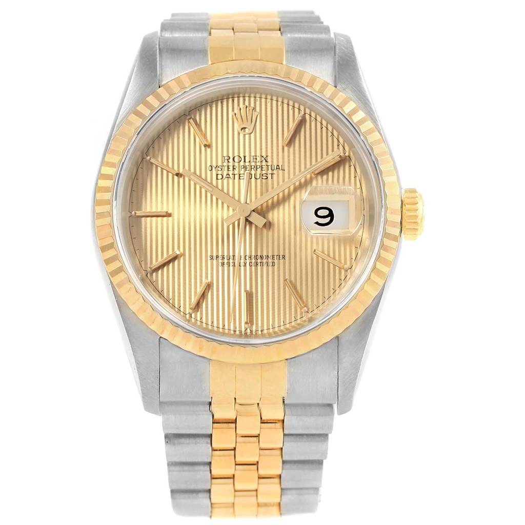 The image shows a front angle of a Rolex Datejust 16233 Men's Steel and Gold (two tone) Champagne Dial 16233 Men's Steel and Gold (two tone) Champagne Dial watch, highlighting its gold fluted bezel, champagne dial, and two-tone bracelet.