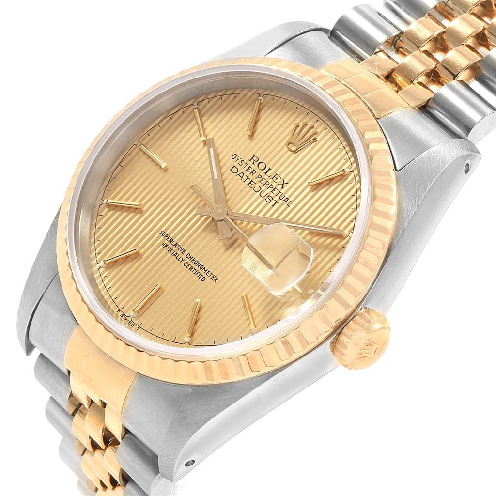 This image shows a Rolex Datejust 16233 Men's Steel and Gold (two tone) Champagne Dial 16233 Men's Steel and Gold (two tone) Champagne Dial watch from an angled view, highlighting the dial, bezel, case, crown, and bracelet.