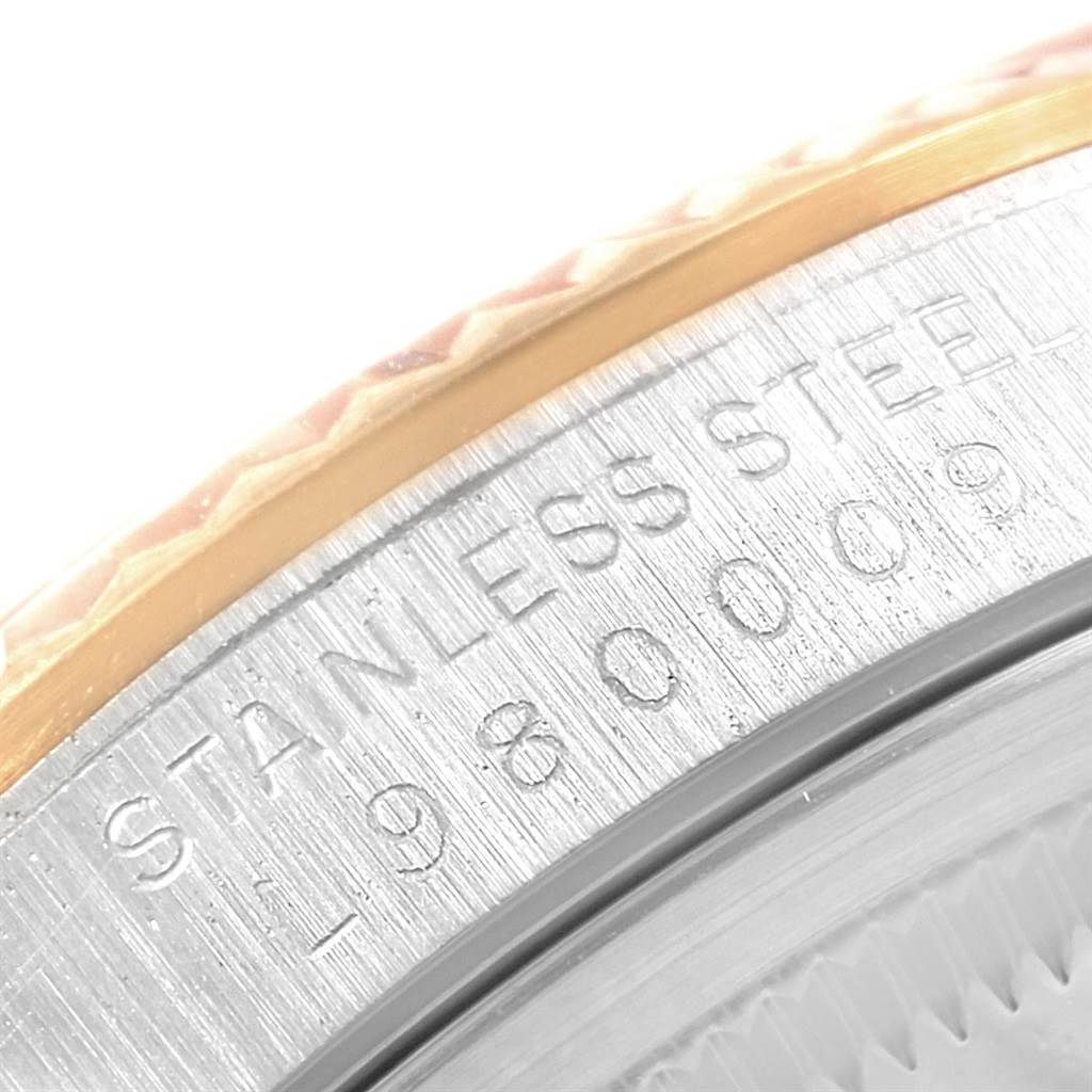 The image shows a close-up angle of the Rolex Datejust 16233 Men's Steel and Gold (two tone) Champagne Dial 16233 Men's Steel and Gold (two tone) Champagne Dial's bezel and case, displaying the engraved text and material details.