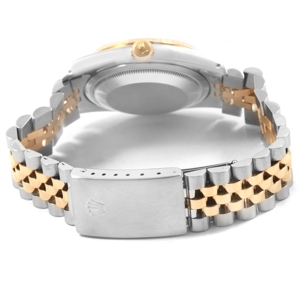 The image shows the Rolex Datejust 16233 Men's Steel and Gold (two tone) Champagne Dial 16233 Men's Steel and Gold (two tone) Champagne Dial from the back, highlighting its case, two-tone bracelet, and clasp.