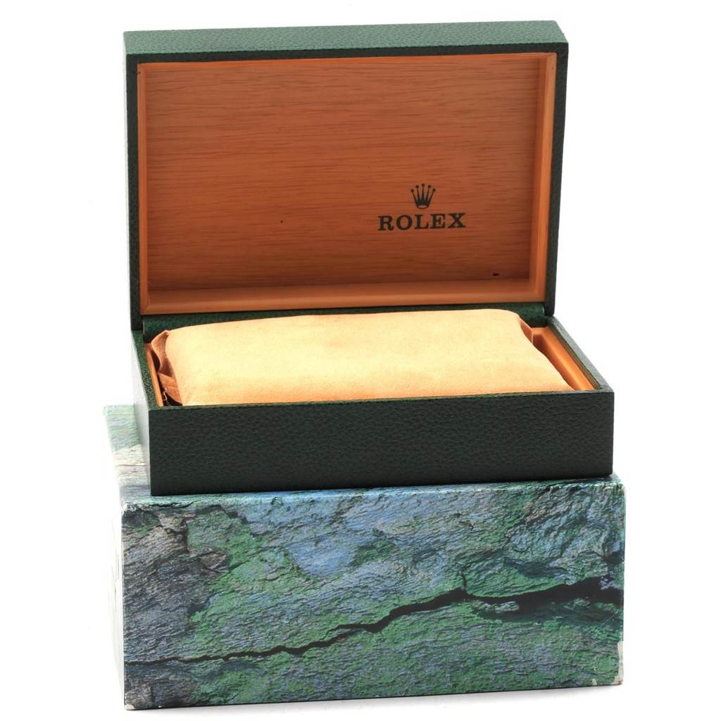 This image shows the packaging for a Rolex Datejust 16233 Men's Steel and Gold (two tone) Silver Dial 16233 Men's Steel and Gold (two tone) Silver Dial, highlighting the open box with cushion and the outer box.