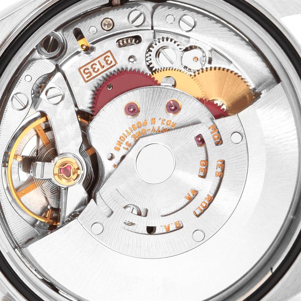 This image shows an internal view of a Rolex Datejust 16233 Men's Steel and Gold (two tone) Silver Dial 16233 Men's Steel and Gold (two tone) Silver Dial model watch, highlighting various gears and mechanisms of its movement.
