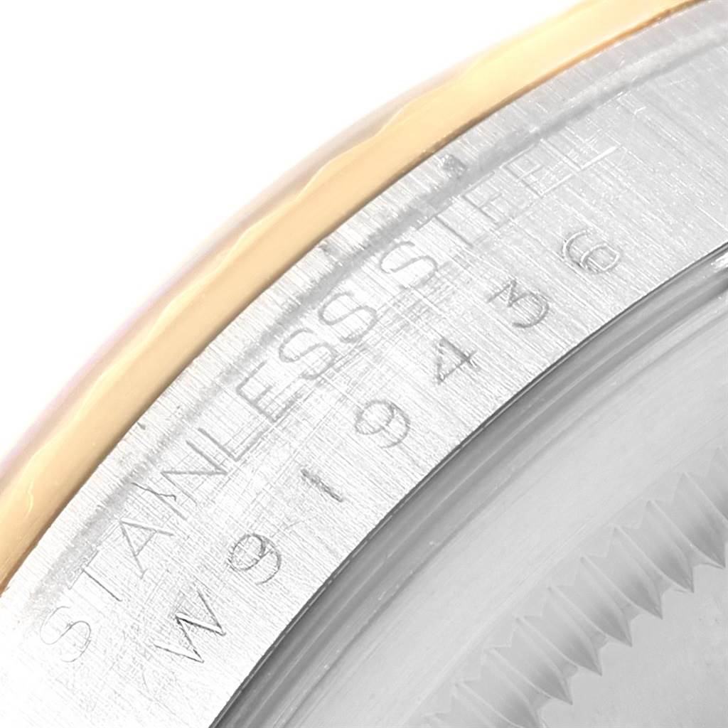 The image shows a close-up of the stainless steel bezel with model engravings of the Rolex Datejust 16233 Men's Steel and Gold (two tone) Silver Dial 16233 Men's Steel and Gold (two tone) Silver Dial watch.