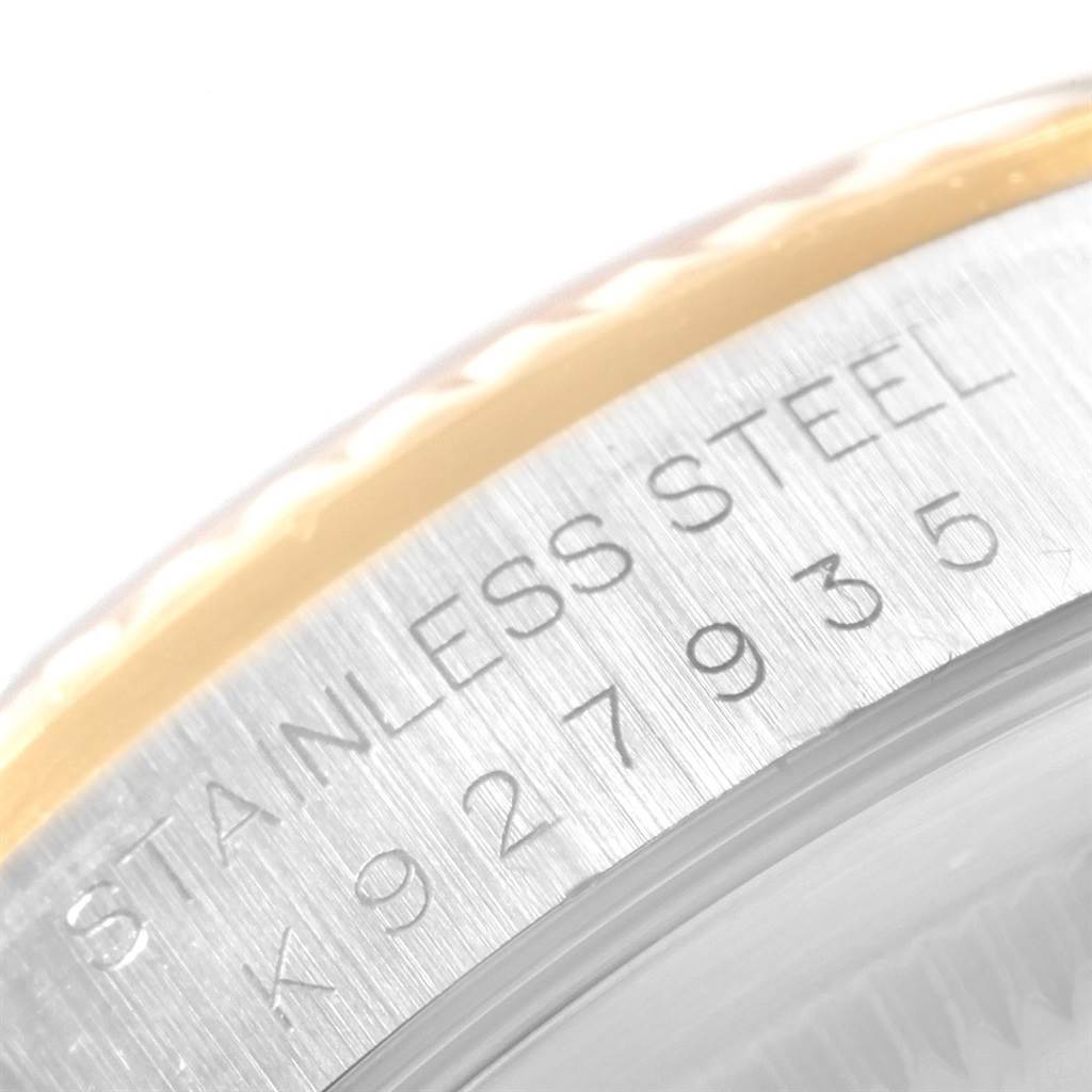 This is a close-up image of the stainless steel case of a Rolex Datejust 16233 Men
s Steel and Gold (two tone) Black Dial 16233 Men
s Steel and Gold (two tone) Black Dial watch, showing its serial number.