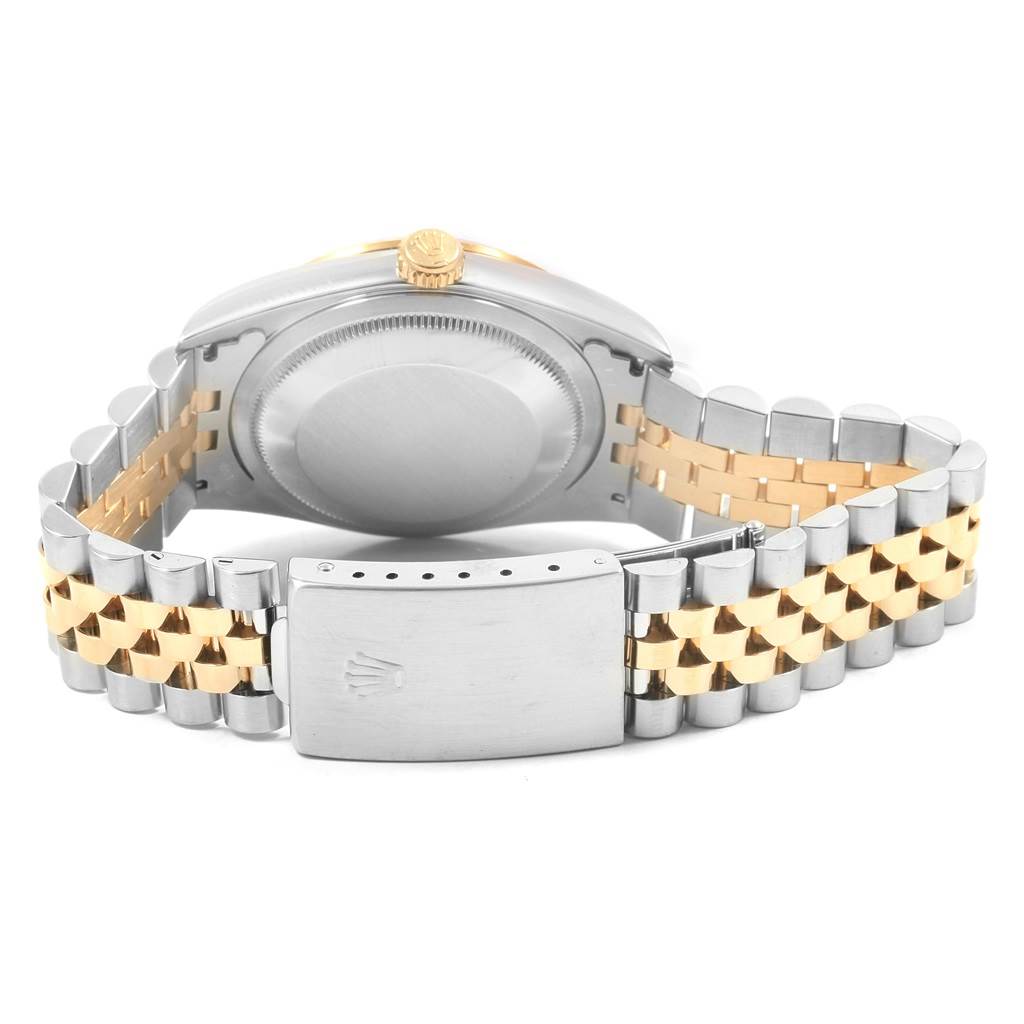 This image shows the backside of a Rolex Datejust 16233 Men's Steel and Gold (two tone) Silver Dial 16233 Men's Steel and Gold (two tone) Silver Dial watch, highlighting the case back and the two-tone bracelet.