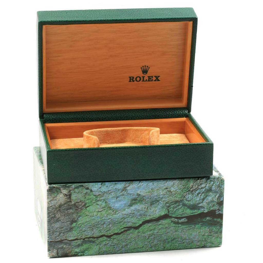This image shows an opened green Rolex watch box for a Datejust model, highlighting the interior lining and cushion.