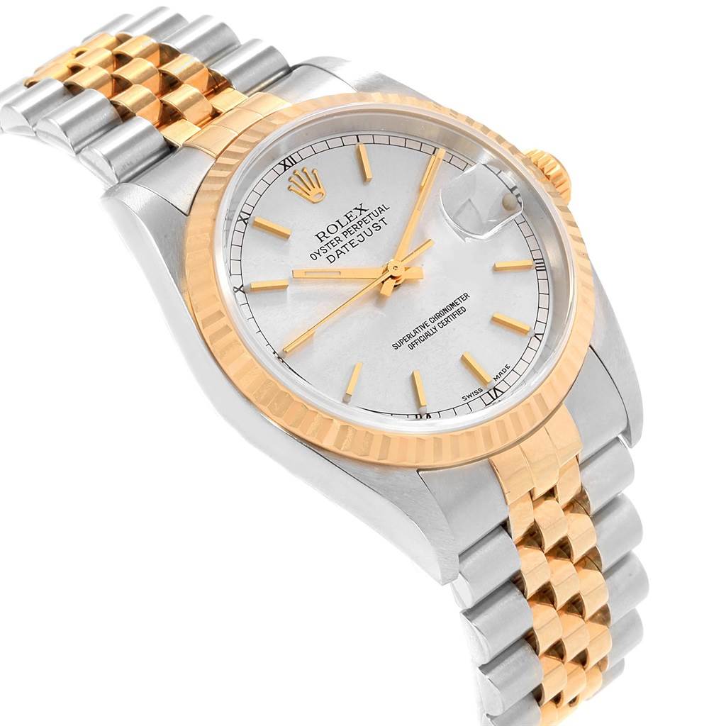 The image shows a Rolex Datejust 16233 Men's Steel and Gold (two tone) Silver Dial 16233 Men's Steel and Gold (two tone) Silver Dial watch with a two-tone bracelet, fluted bezel, and silver dial, viewed at an angled perspective.