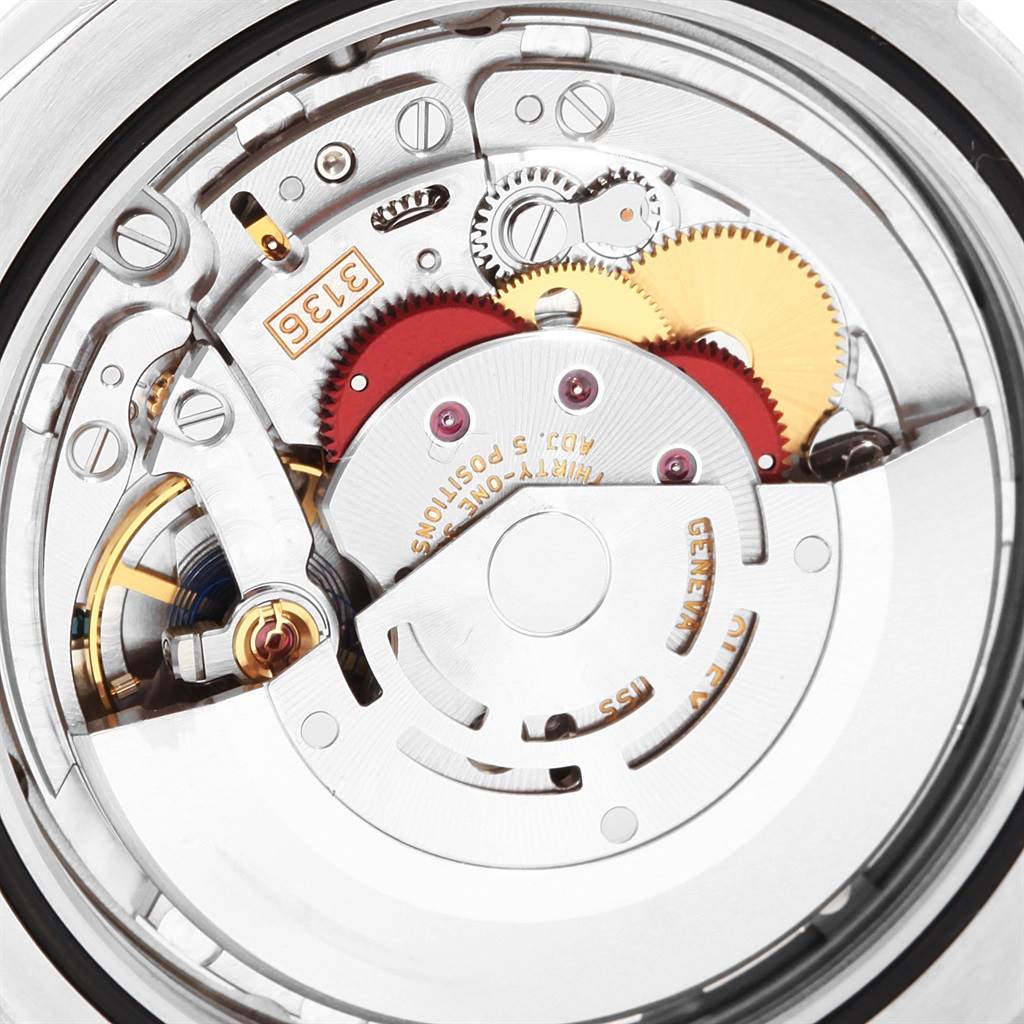 The image shows the intricate inner mechanics and movement components of a Rolex Datejust 116300 Men's Stainless Steel Blue Dial 116300 Men's Stainless Steel Blue Dial watch, viewed from the back.