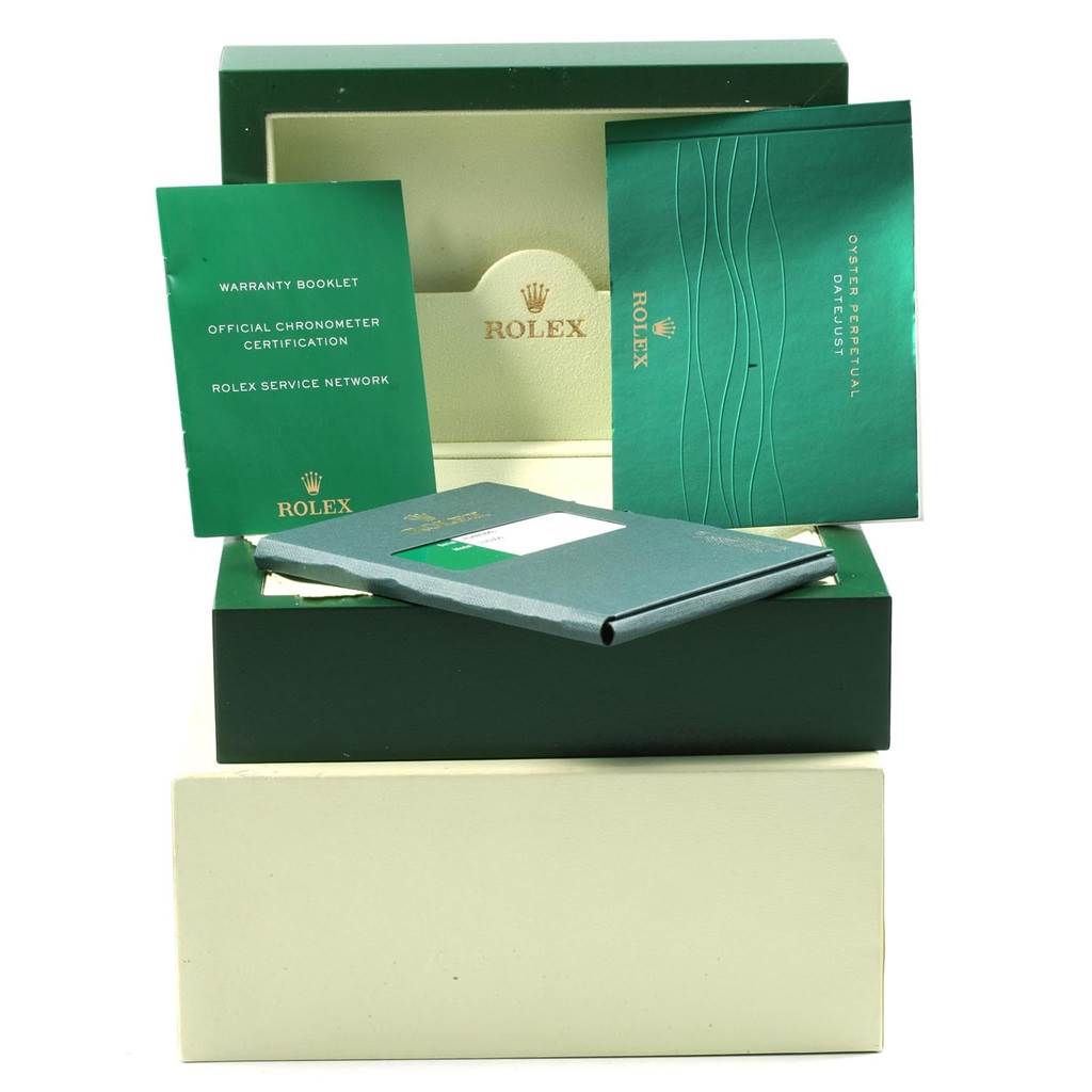 This image shows the packaging and booklets for a Rolex Datejust 116300 Men's Stainless Steel Blue Dial 116300 Men's Stainless Steel Blue Dial, including warranty and certification documents.