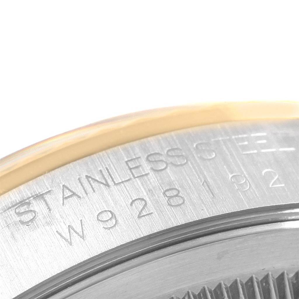 This close-up image shows the engraved stainless steel case back of a Rolex Datejust 16233 Men's Steel and Gold (two tone) Mother of Pearl Dial 16233 Men's Steel and Gold (two tone) Mother of Pearl Dial watch.