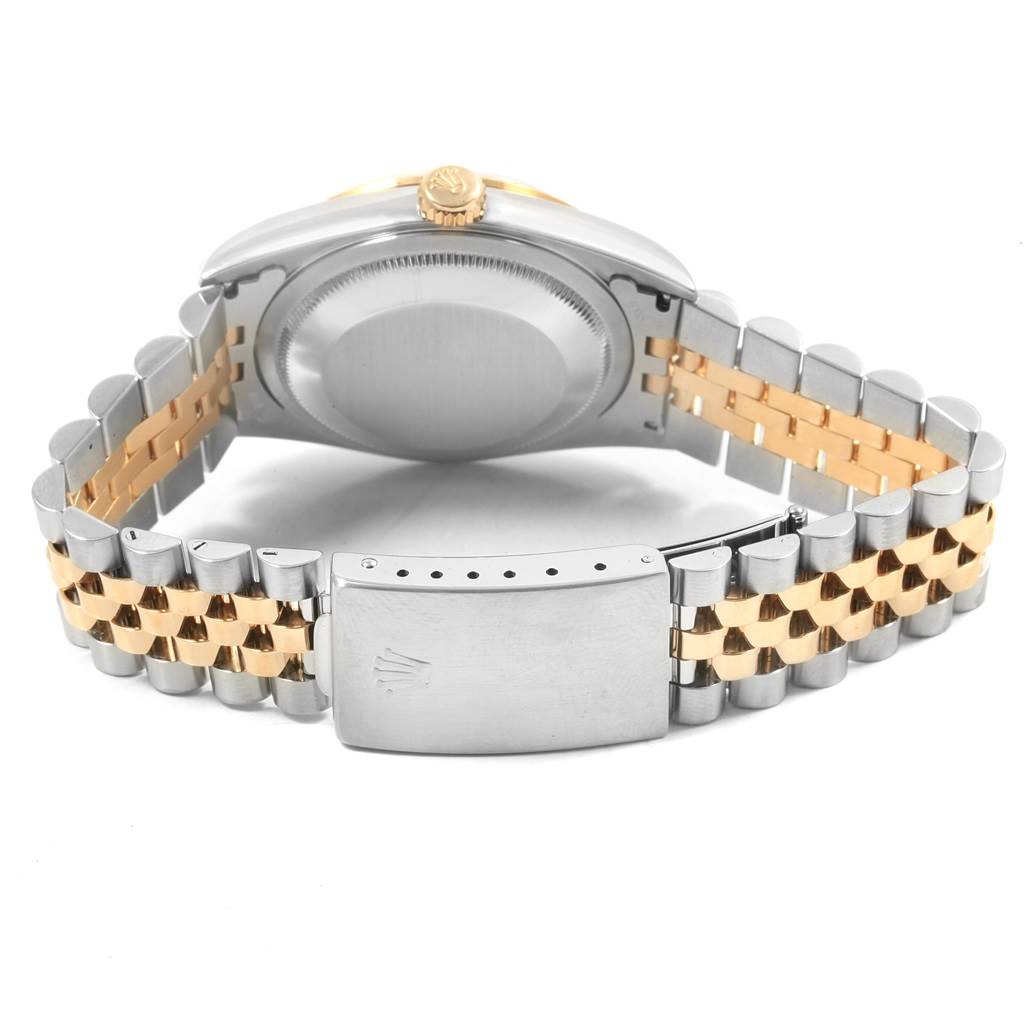 This image shows the Rolex Datejust 16233 Men's Steel and Gold (two tone) Mother of Pearl Dial 16233 Men's Steel and Gold (two tone) Mother of Pearl Dial watch from a rear angle, highlighting the case back, crown, and two-tone jubilee bracelet with the clasp visible.