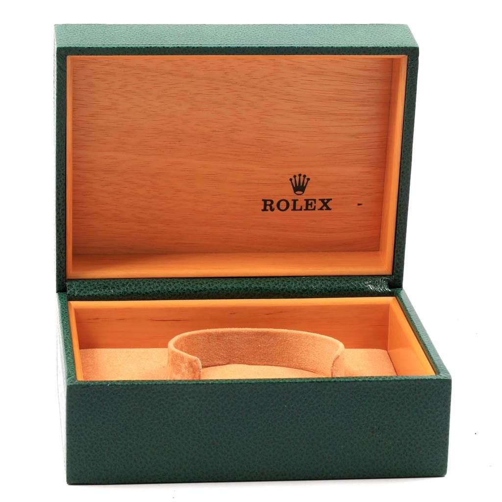 This image shows an open green Rolex Datejust 16203 Men's Steel and Gold (two tone) White Dial 16203 Men's Steel and Gold (two tone) White Dial watch box with a tan cushion inside.