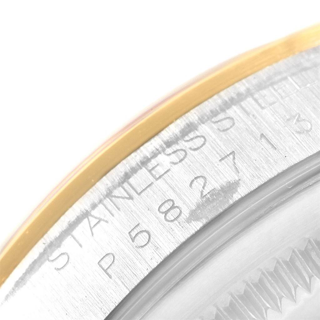 This close-up angle shows the side of the bezel and the stainless steel part of the case on a Rolex Datejust 16203 Men's Steel and Gold (two tone) White Dial 16203 Men's Steel and Gold (two tone) White Dial watch.