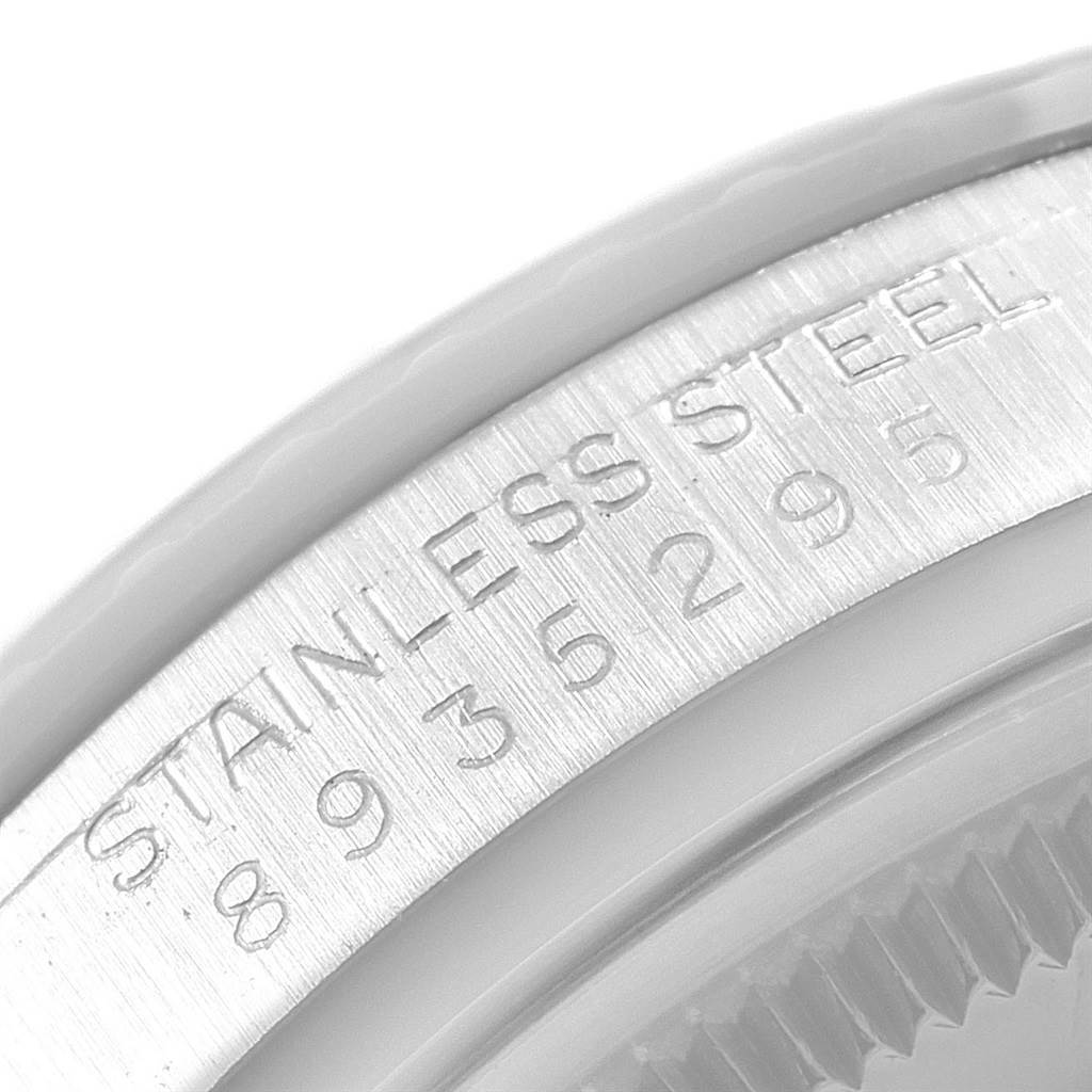 This close-up image shows the case side of a Rolex Datejust 16030 Men's Stainless Steel Silver Dial 16030 Men's Stainless Steel Silver Dial watch, highlighting the serial number engraved on the stainless steel.