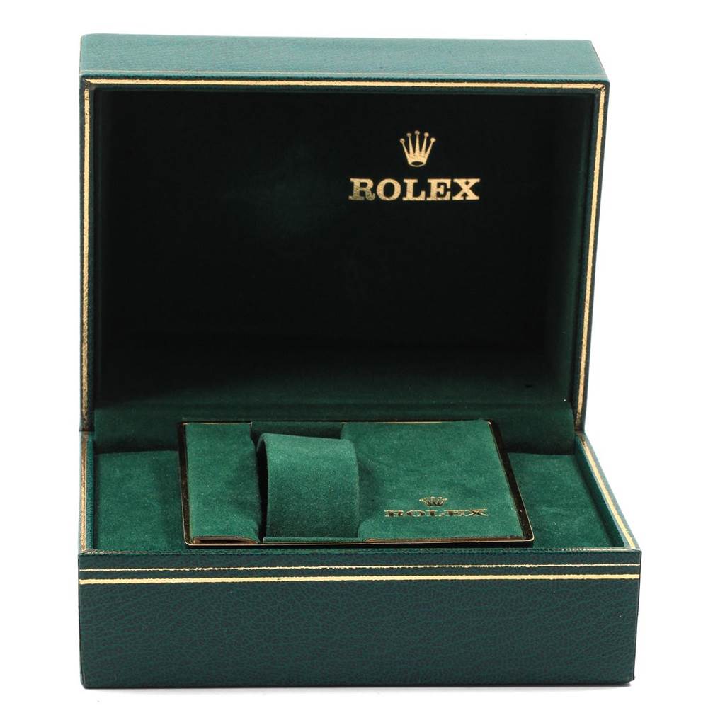 The image shows an open green Rolex box for the Datejust model with a cushion and a cardholder.