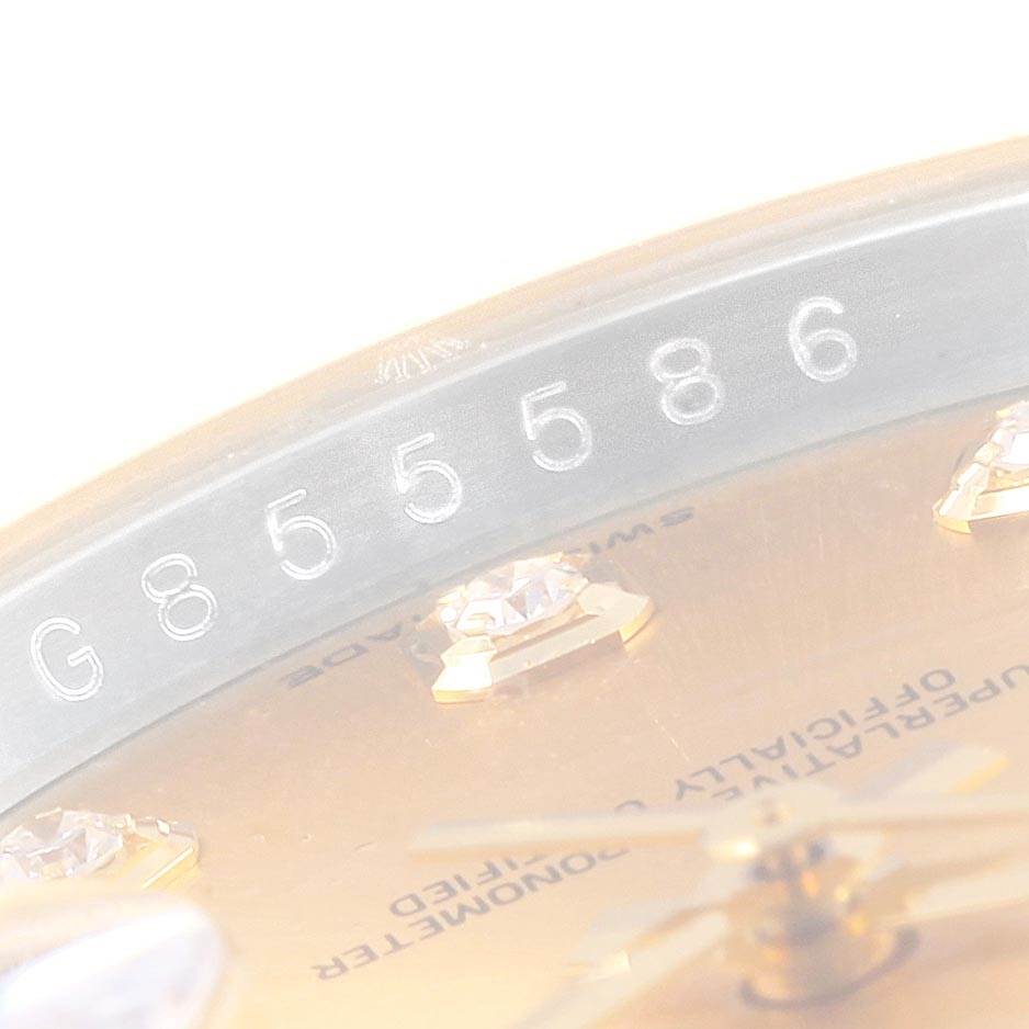This image shows a close-up of the serial number, dial details, and diamonds on a Rolex Datejust 116203 Men's Stainless Steel Champagne Dial 116203 Men's Stainless Steel Champagne Dial watch.