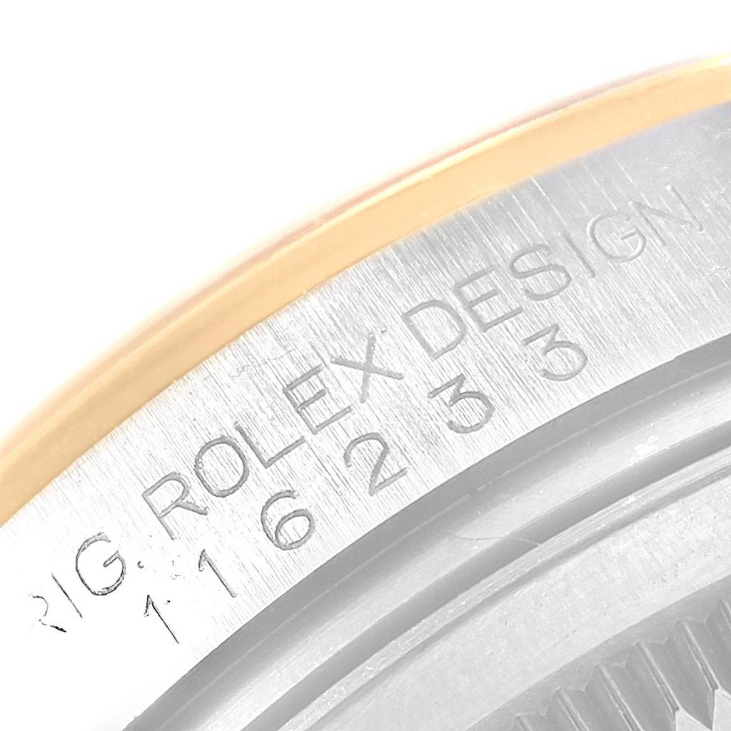 This image shows a close-up of the bezel and case side of a Rolex Datejust 116203 Men's Stainless Steel Champagne Dial 116203 Men's Stainless Steel Champagne Dial watch, highlighting the model number engraving.