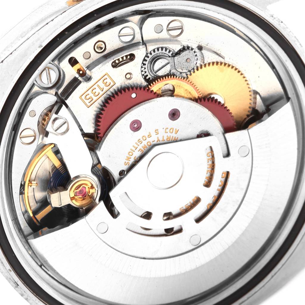 This image shows the intricate internal mechanism of the Rolex Datejust 116203 Men's Stainless Steel Champagne Dial 116203 Men's Stainless Steel Champagne Dial watch from a close-up, rear angle.