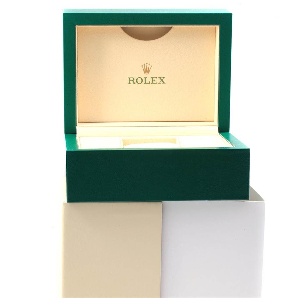 The image shows an open green and beige Rolex Datejust 116203 Men's Stainless Steel Champagne Dial 116203 Men's Stainless Steel Champagne Dial watch box from a frontal angle.