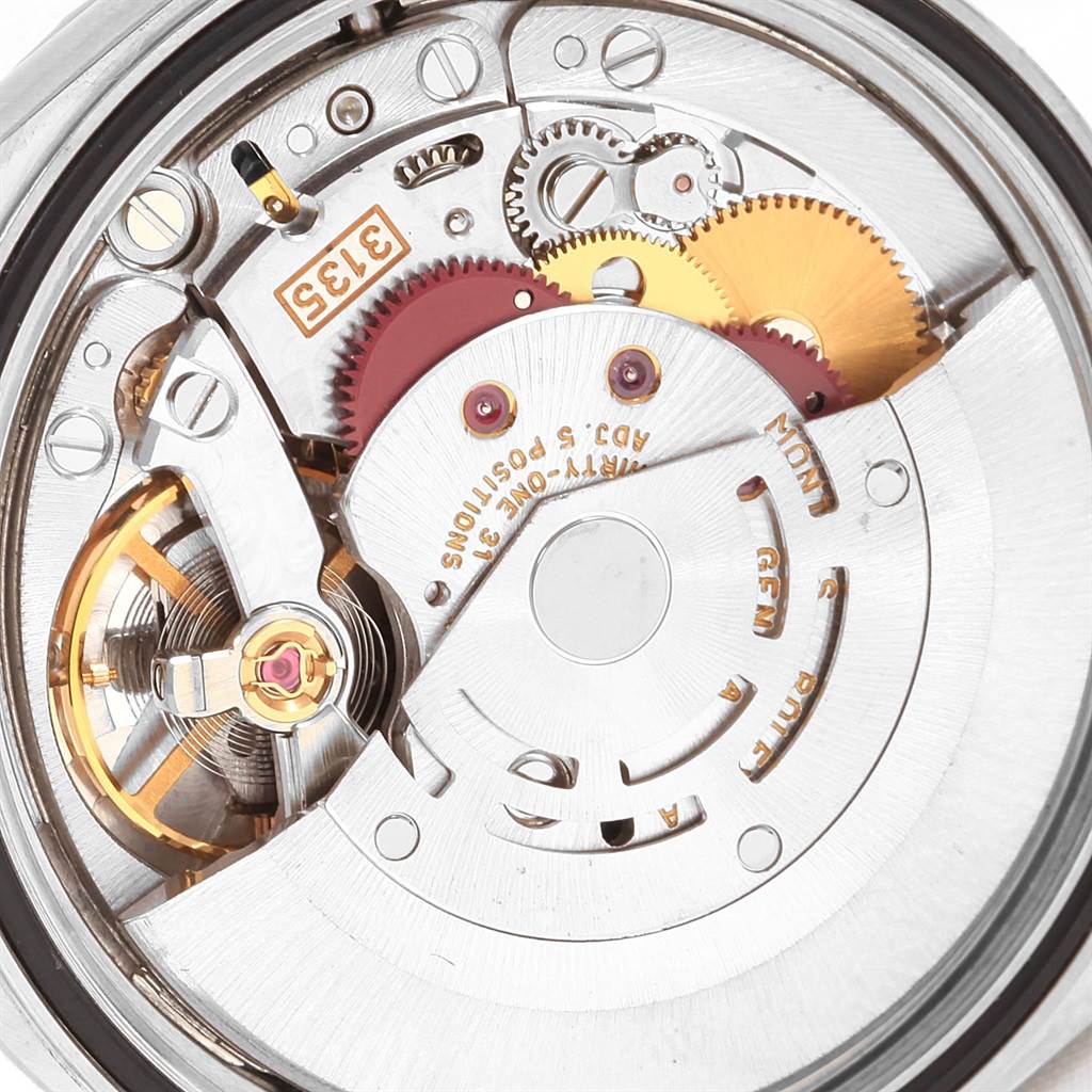 This image shows the internal mechanical movement of a Rolex Datejust 16220 Men
s Stainless Steel Black Dial 16220 Men
s Stainless Steel Black Dial watch, highlighting gears and components.