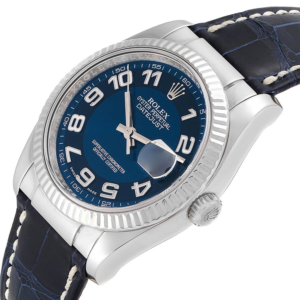 The Rolex Datejust 116139 Men's White Gold Blue Dial 116139 Men's White Gold Blue Dial watch is shown at a slight angle, showcasing its blue dial, fluted bezel, and leather strap.